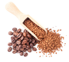 Granulated coffee in a spatula and coffee beans on a white background, isolated. The view from top