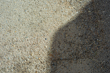Asphalt surface with shadow from above