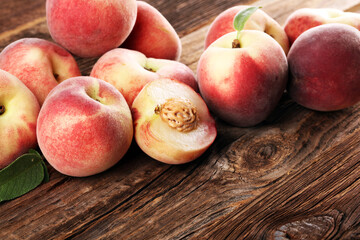 Fototapeta na wymiar A group of ripe peaches on wooden table
