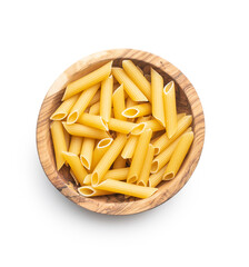 Uncooked penne pasta in bowl. Dried italian pasta