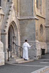 Altar boy outside Matthias Church on Buda Hill in Budapest