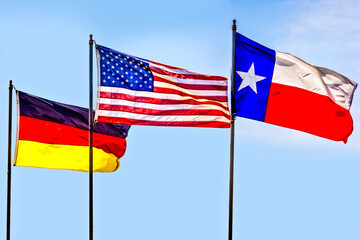 The flags of Germany, USA and Texas side by side