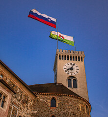 Ljubljana castle with Slovenian and Ljubljana flags.