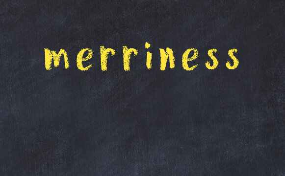 College chalk desk with the word merriness written on in