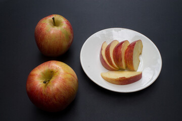 Pieces of apple on a white plate