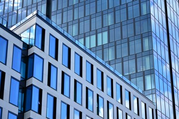 Facade texture of a glass mirrored office building. Fragment of the facade. Modern architecture of the office building.