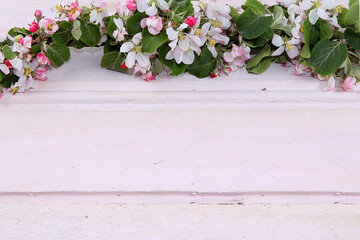 Abstract floral arrangement on a wooden background, place for text, flat lay. Creative modern bouquet, minimal holiday concept. Flower card, spring banner