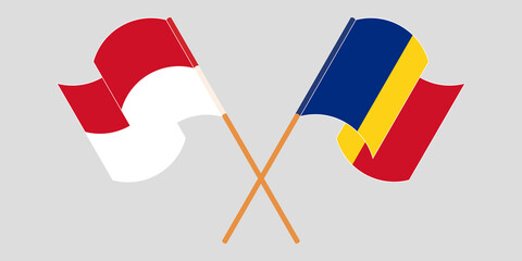 Naklejka premium Crossed and waving flags of Indonesia and Romania