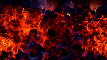 Fototapeta na wymiar Burning coal, soft focus. Textures, background, abstract