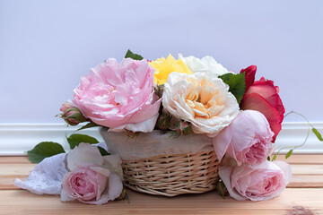 Beautiful summer bouquet in kettle on yellow-blue background