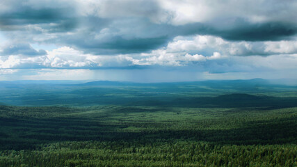 A sign in front of a cloudy sky