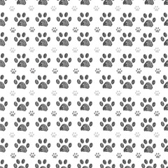 Fototapeta na wymiar Doodle grey big and small paw print seamless fabric design repeated pattern with grey background