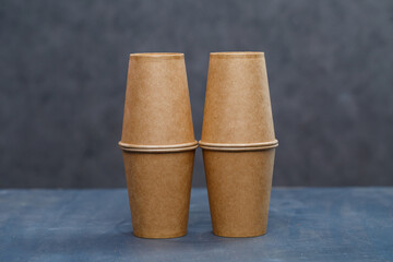 Paper cups for drinking, dishes. Disposable cardboard dishes made from environmentally friendly materials. Doesn't clog nature Eco-friendly, disposable, reusable, compostable dishes.