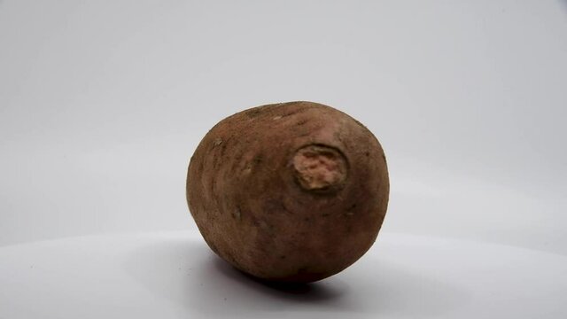 Sweet potato spinning with a white background. 