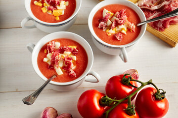 Tomato soup, salmorejo, with raw ingredients on a table