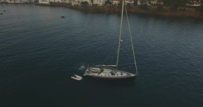 Yacht in the evening in the bay of Cadaques. High quality footage