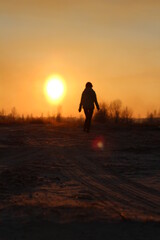 girl in the shade at sunset