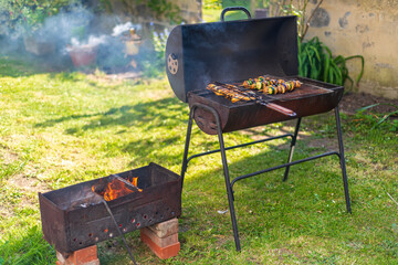Barbecue grill with fire in the garden, outdoor, close up, London, UK