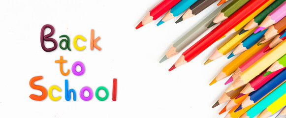  Top view banner message " Back to School " with color pencil  Items for the school on white background