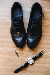 Men's wedding accessories on wood texture background. Brutal men accessories.