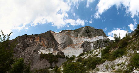 Fototapeta na wymiar Panoramic view of marble quarry from Vara bridge. Carrara. Apuan Alps. 