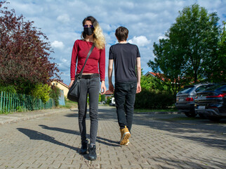 Fototapeta premium Concept of two people maintaining social distance on the street