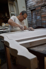 Mature latin man working the wood