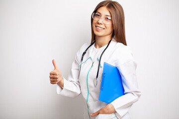 Doctor woman in white coat holding patient card