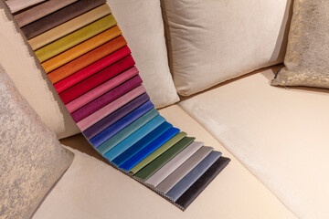 Sofa color chart. Upholstery catalogue. Closeup of samples of fabric for sofa and other pieces of...
