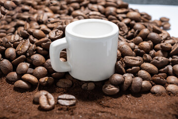 CUP OVER ROASTED COFFEE BEANS