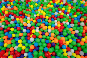 Fototapeta na wymiar background beautiful with Colored plastic balls in pool of game room. Swimming pool for fun