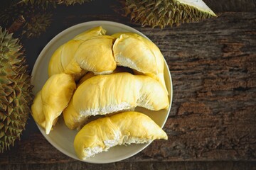 Durian the King of fruits, Durian fruit on   wood  background ,durian fruit with delicious golden yellow soft flesh