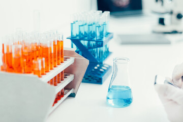 image of containers with test tubes on a table in the laboratory.