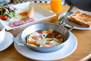 The breakfast.Full Breakfast on Wooden Floor