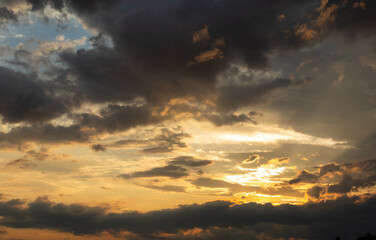 Beautiful sunset sky above clouds with dramatic light