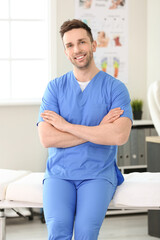 Portrait of massage therapist in medical center