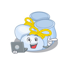 Smart cartoon character of baby boy boots studying at home with a laptop