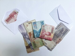 Indonesian money/rupiah with white envelope on white background