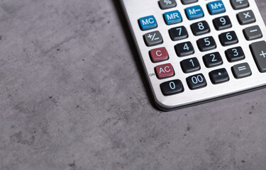 calculator and stationery items on the table for financial activity