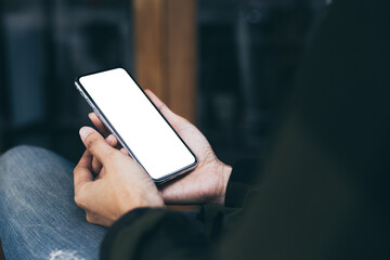 cell phone mockup image blank white screen.woman hand holding texting using mobile on desk at coffee shop.background empty space for advertise.work people contact marketing business,technology