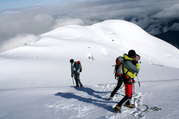 Fototapeta na wymiar Mountaineers getting down at Mont Blanc in French Alps, France.
