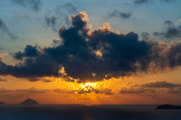 Landscape sunrise on Hon Chong cape, Nha Trang, Vietnam. Travel and nature concept. Morning sky, clouds, sun and sea water