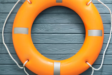 Lifebuoy ring on wooden background