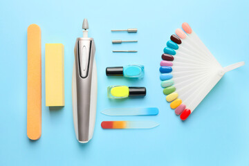 Supplies for manicure on color background