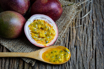 Passion fruit on sack sack cloth with the old wooden floor.