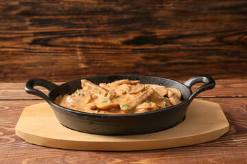 Tasty beef stroganoff on table