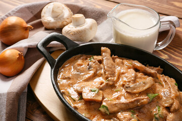 Tasty beef stroganoff on table