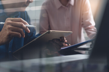 Two business men colleagues working together in office