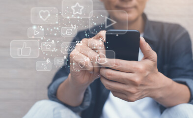 Asian man using social media app on mobile smartphone