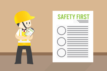 Man Safety inspector hold board checklist of industrial plants Standing inspection in front of the safety first paper workplace for safety first concept
